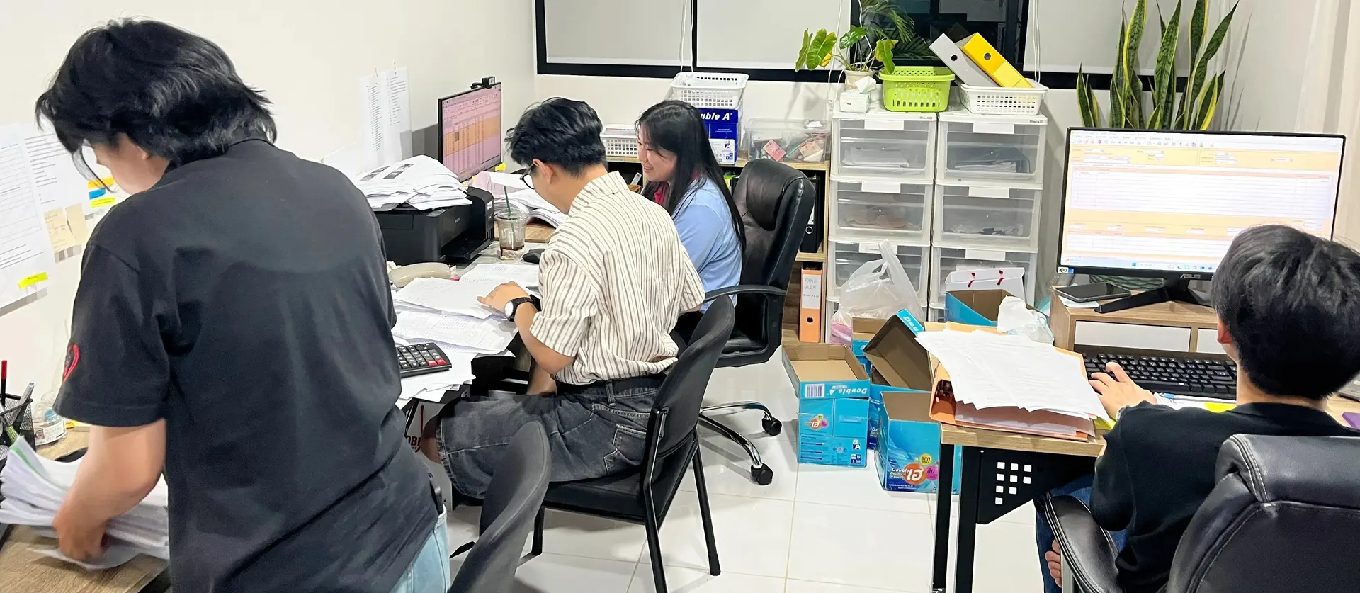 Taxpoint team reviewing documents and system information before tax filing