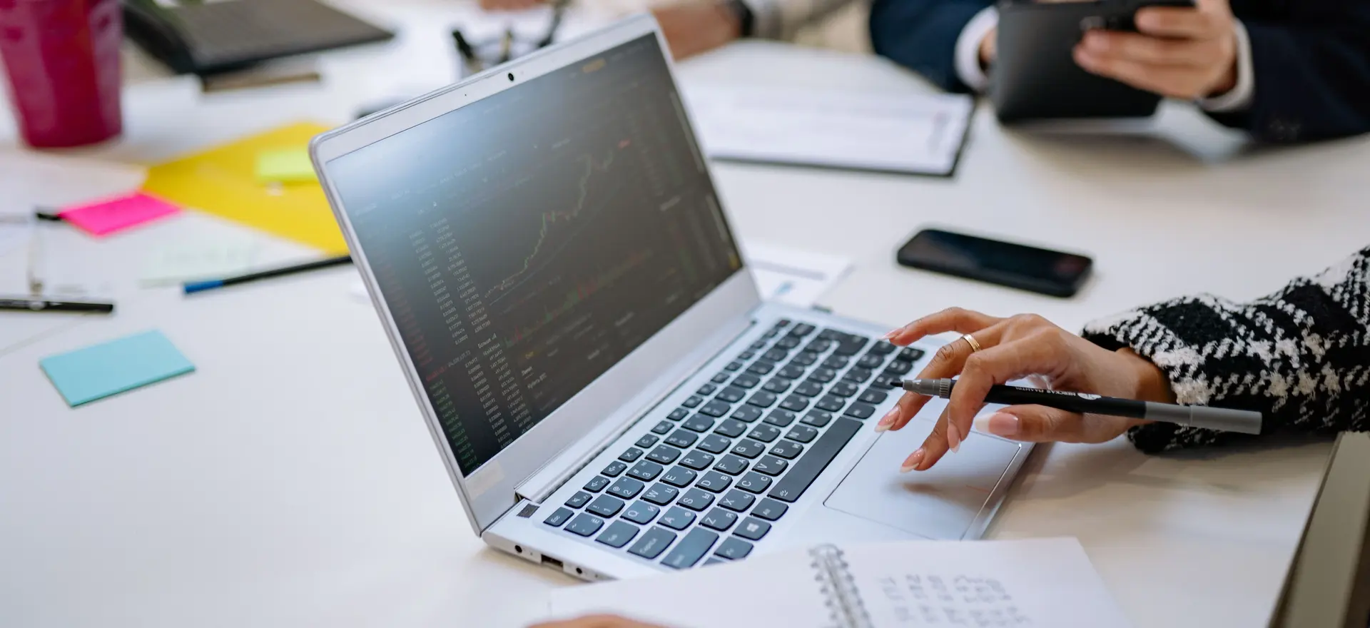 Team analyzing financial data on a computer for accounting system setup