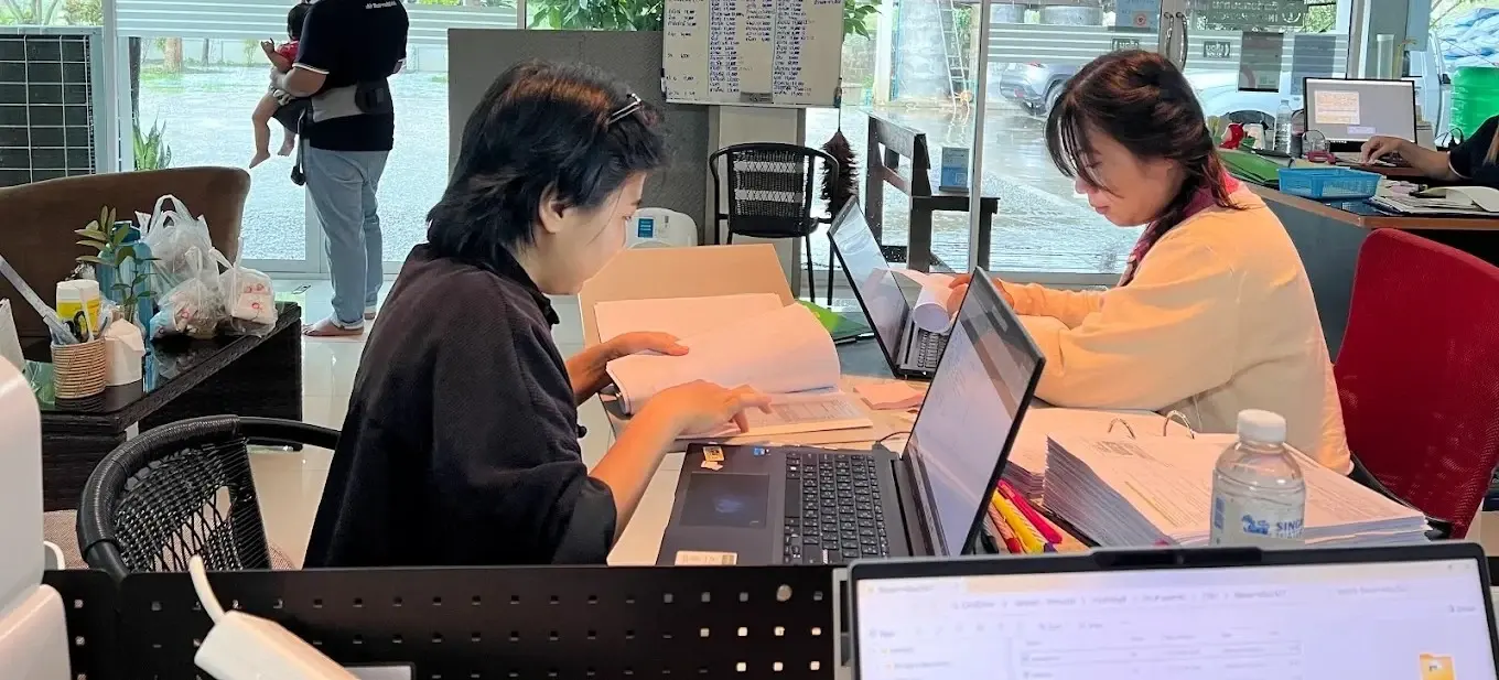 Taxpoint accounting team reviewing documents and recording transactions