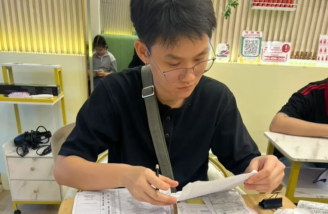 Accountant reviewing receipts and documents for monthly bookkeeping