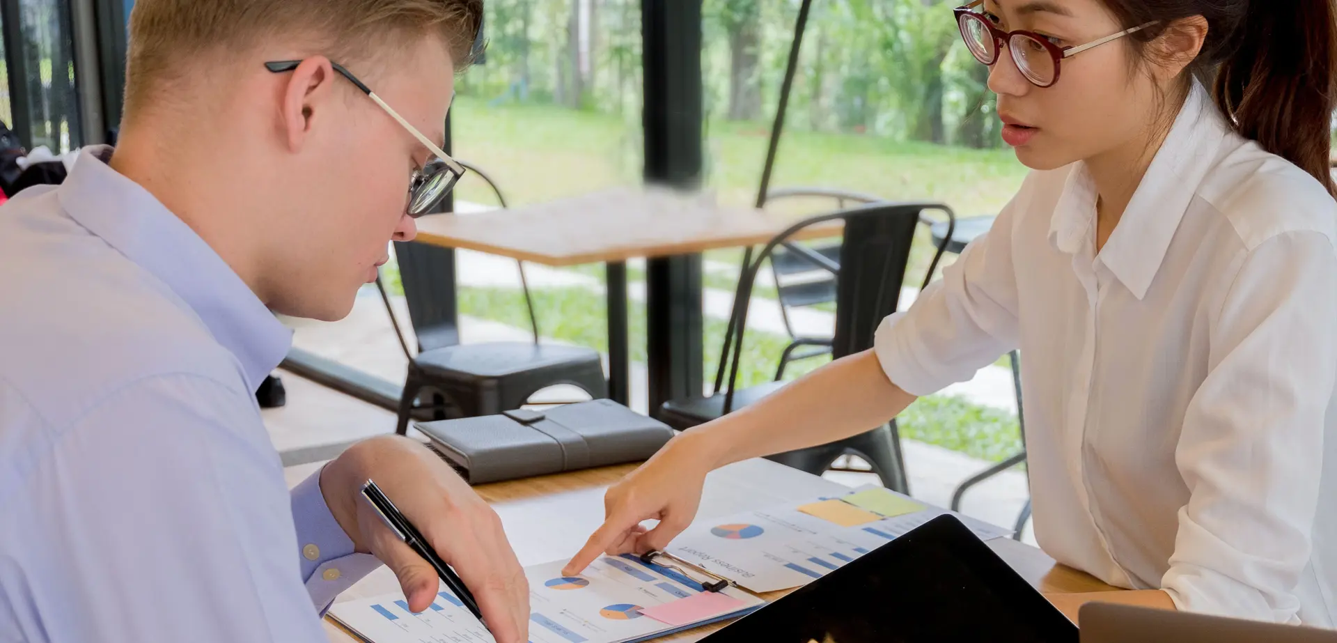 Adviser discussing financial reports for business planning