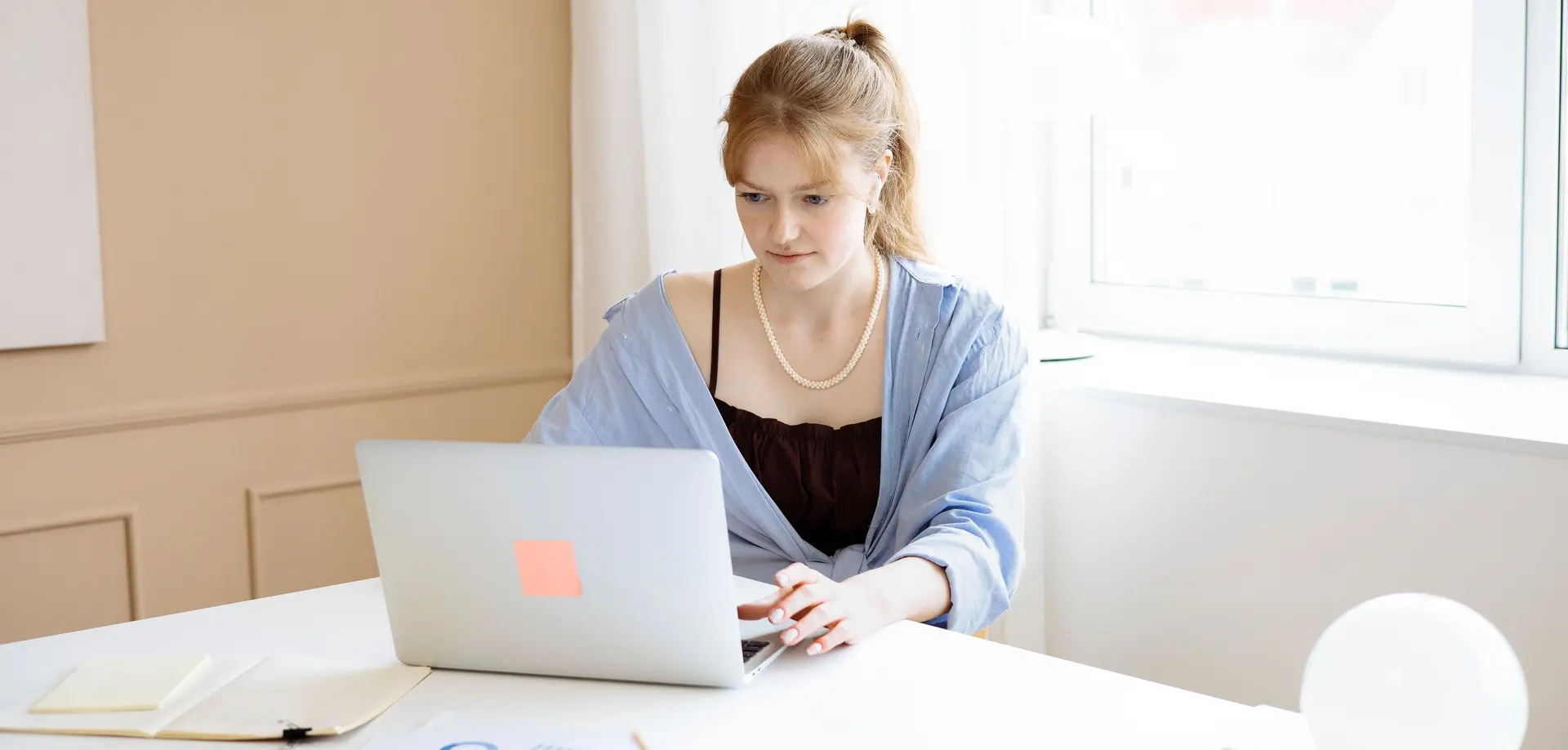 Business owner using a laptop to prepare an online VAT registration application