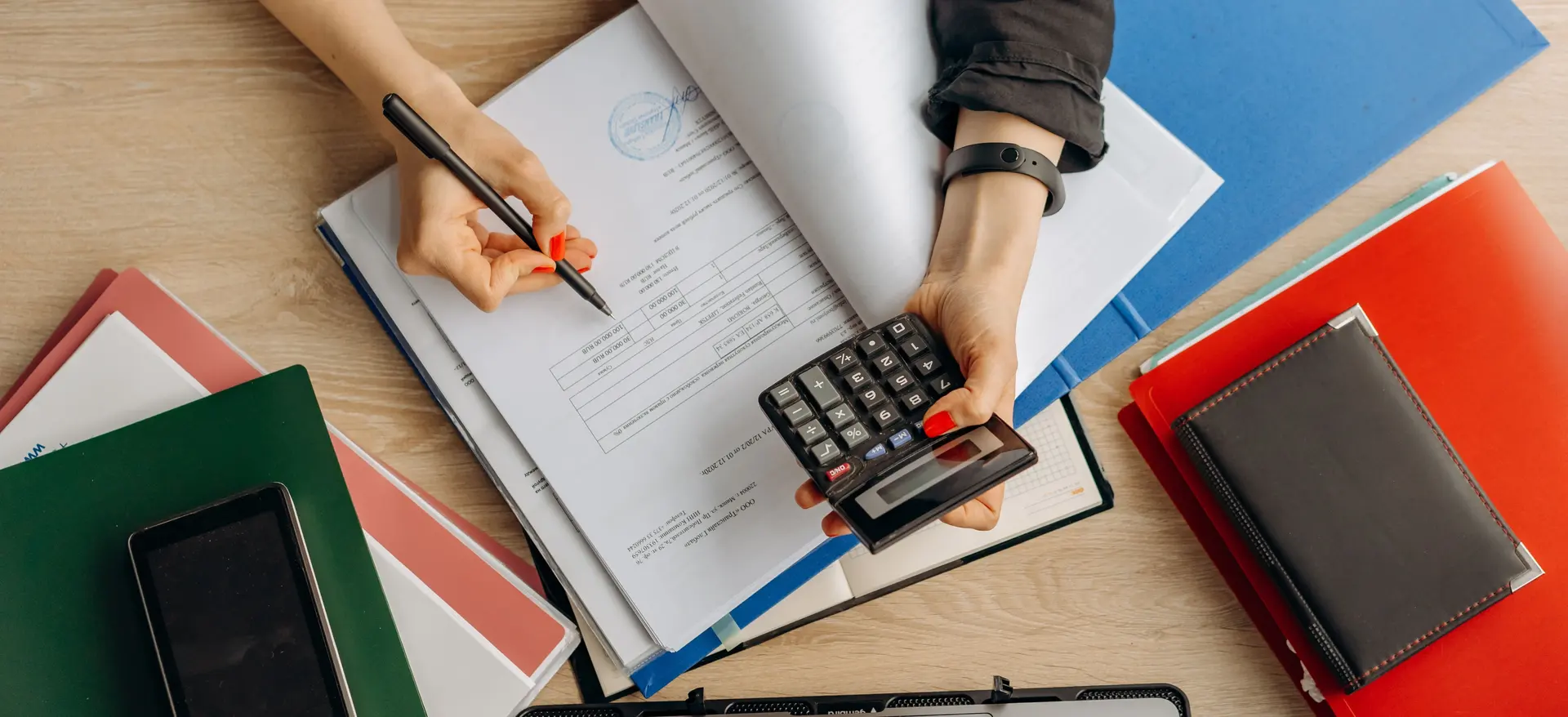 Accountant reviewing financial records to assess VAT registration obligations