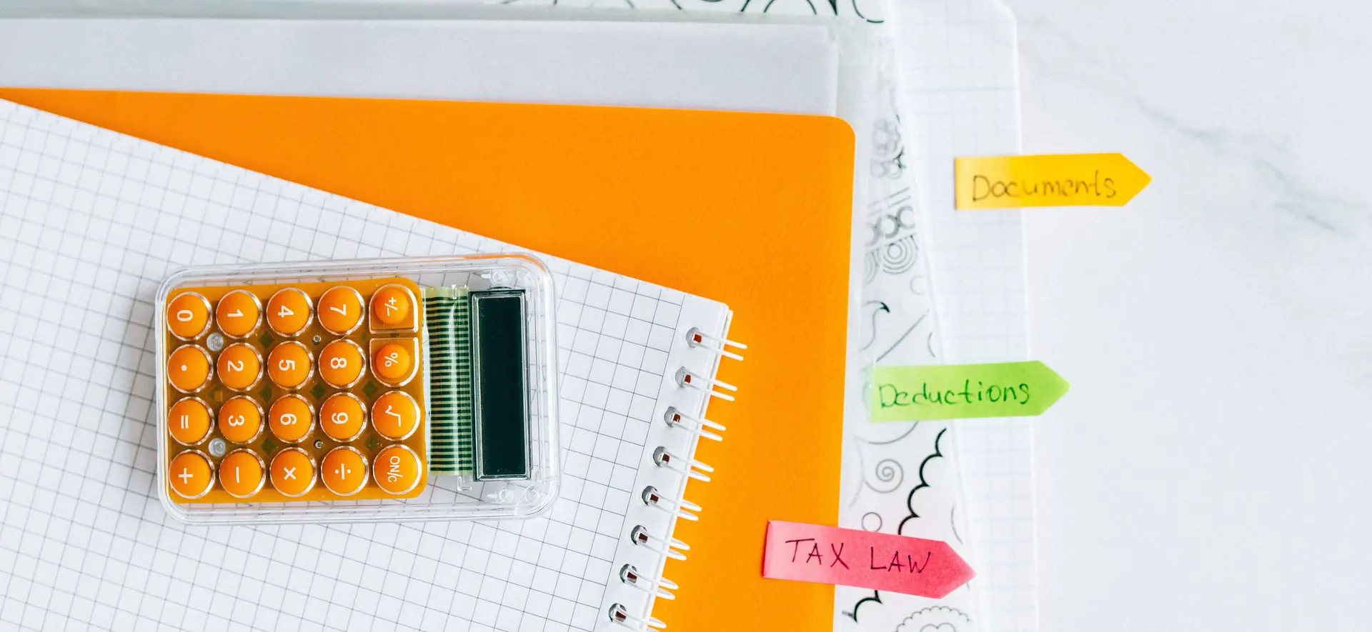 Calculator and documents used for monthly VAT record review