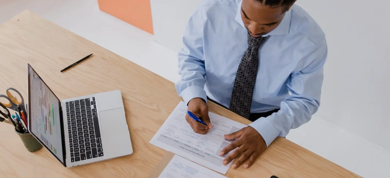 Business owner reviewing documents before submitting a company registration amendment