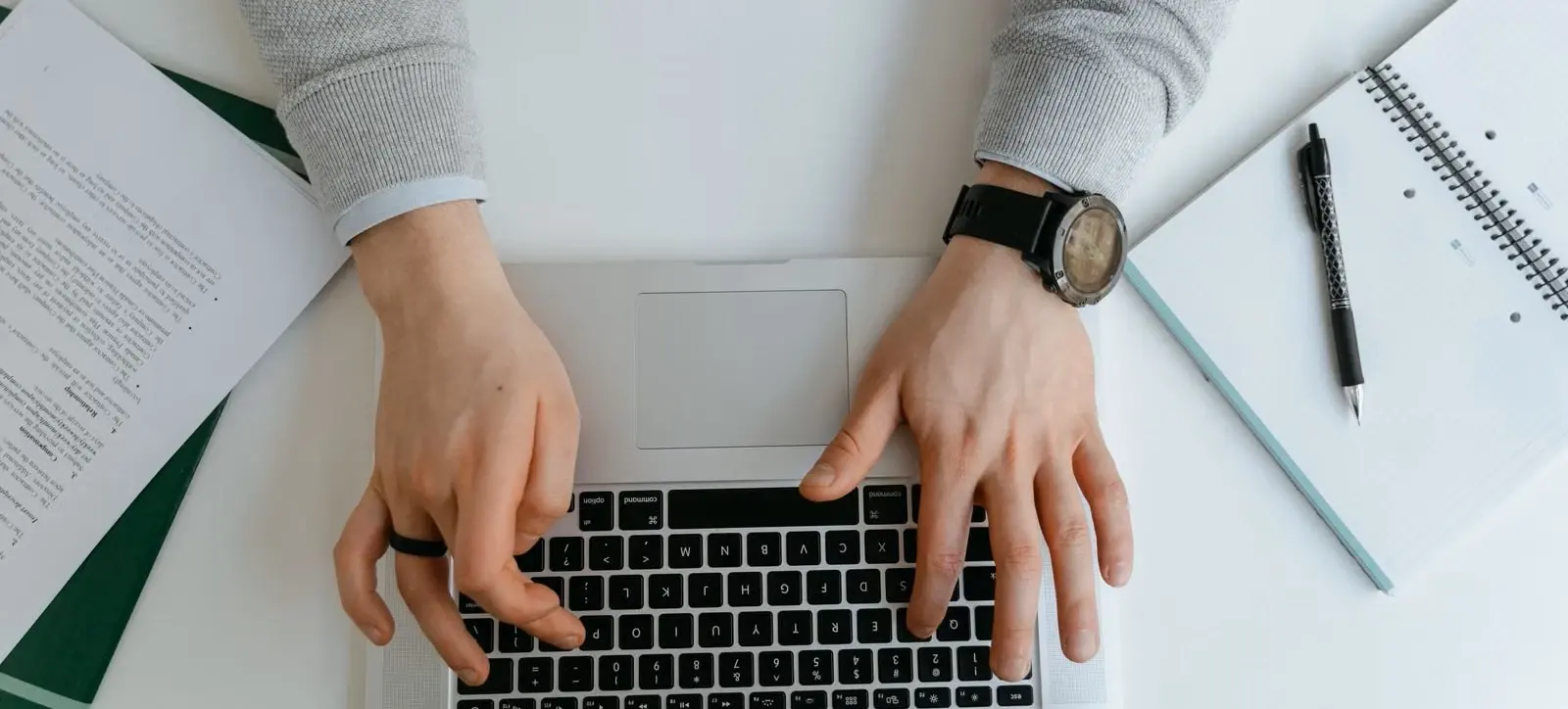 Business owner using a laptop to organize corporate and tax registration amendments