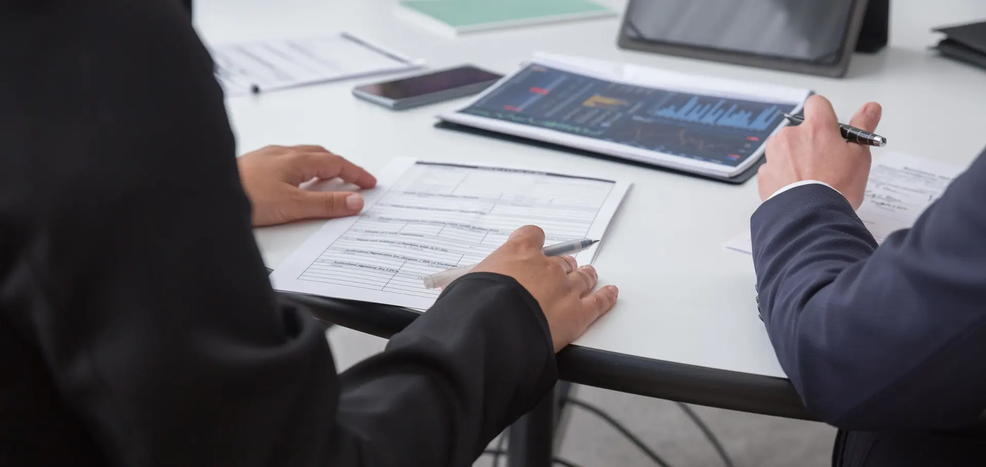 Business owners and advisers reviewing conversion documents