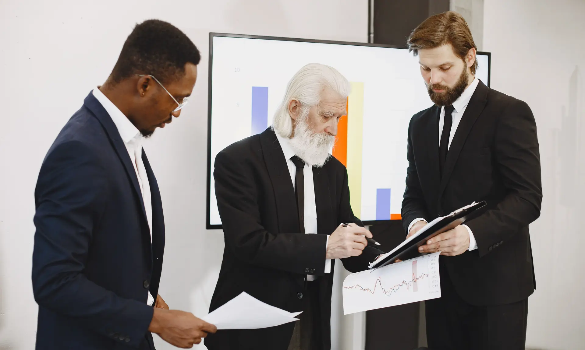 Executives signing a corporate resolution and company dissolution documents